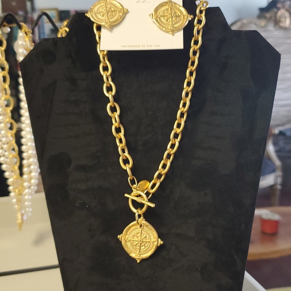 Gold compass medallion necklace.  Earrings also av
